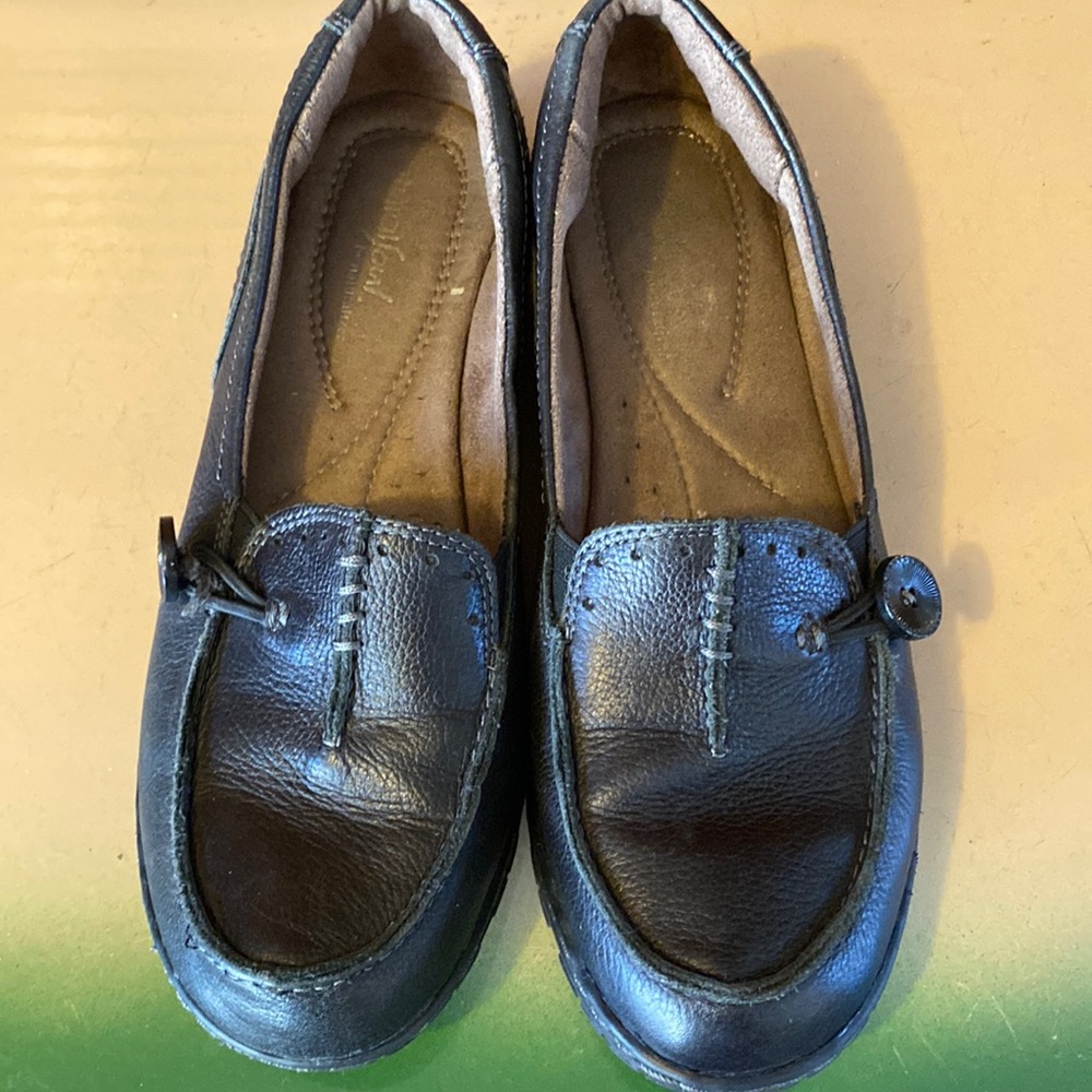 Black loafers, slight heel, button detail size 6.5